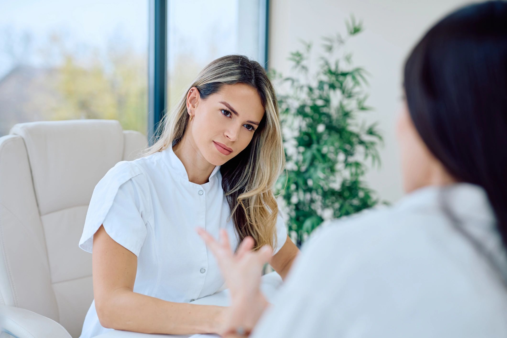 aesthetic nurse with client booking