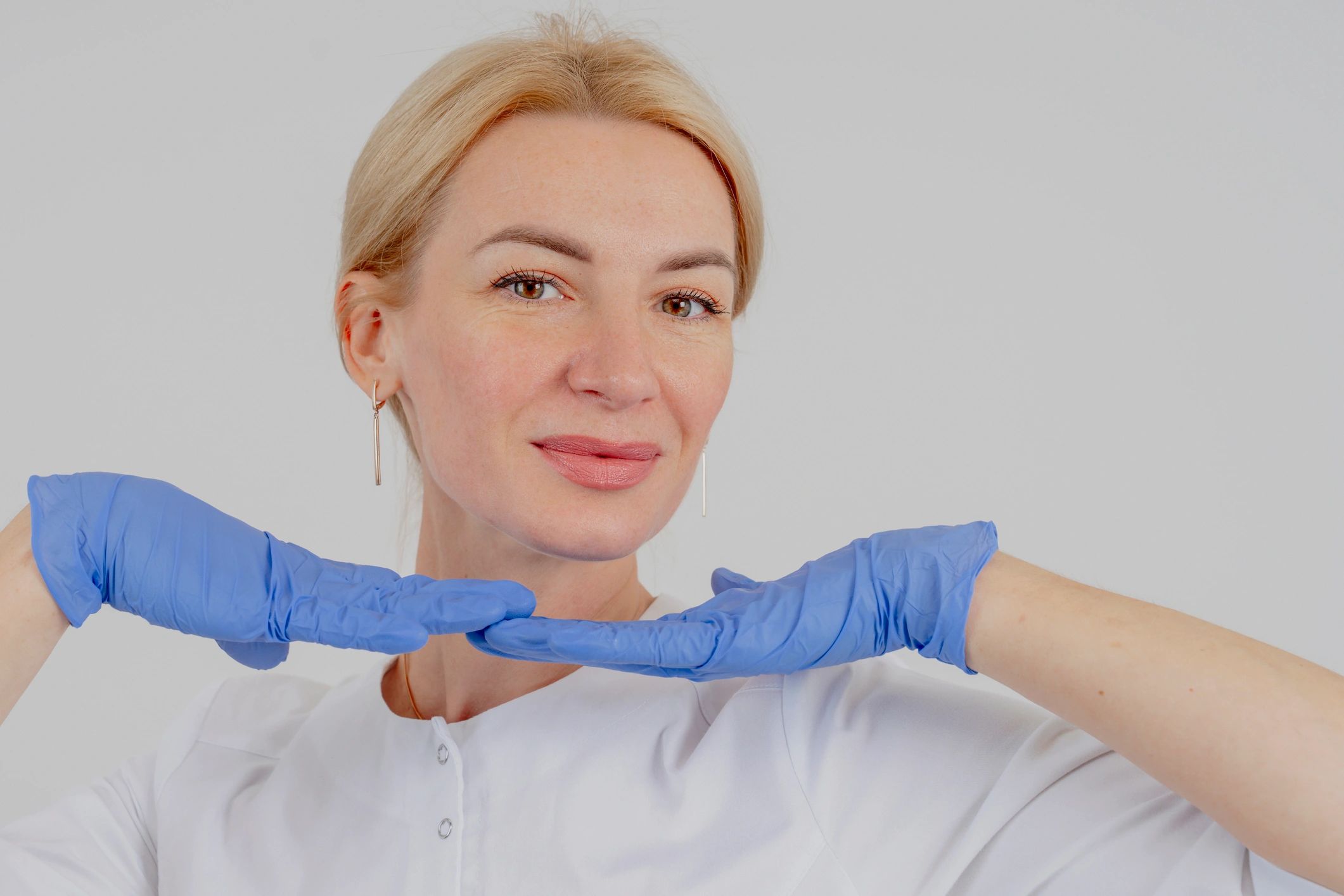 Nurse injector preparing facial rejuvenation procedure